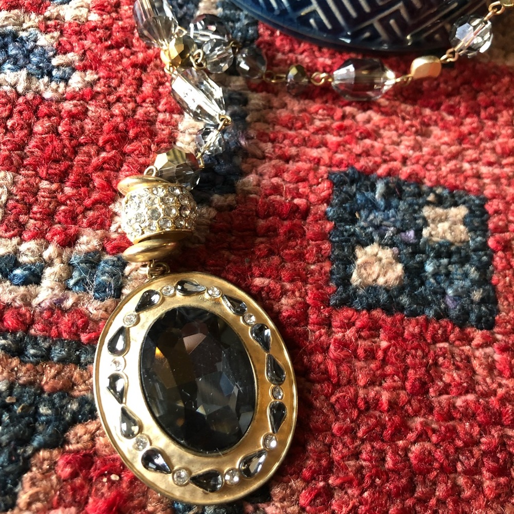 Gold necklace with gold, clear, smoky gray and dark gray glass beads.
